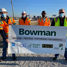 Bowman workers holding banner