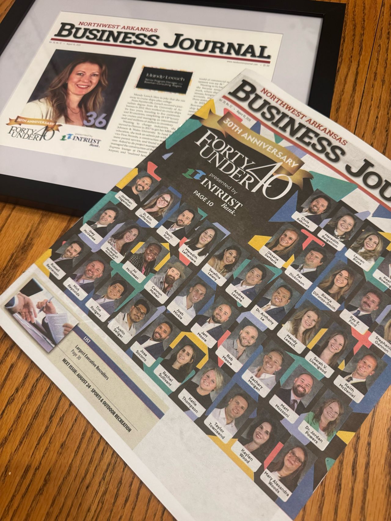 Picture of framed article and magazine cover of Northwest Arkansas Business Journal Forty Under 40 honorees.